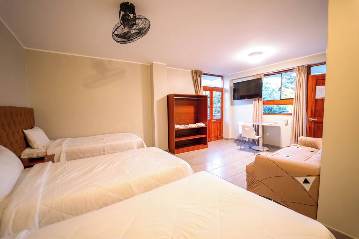 Standard Quadruple Room, Multiple Beds, Balcony, Garden View | Laptop workspace, WiFi (free), bed sheets