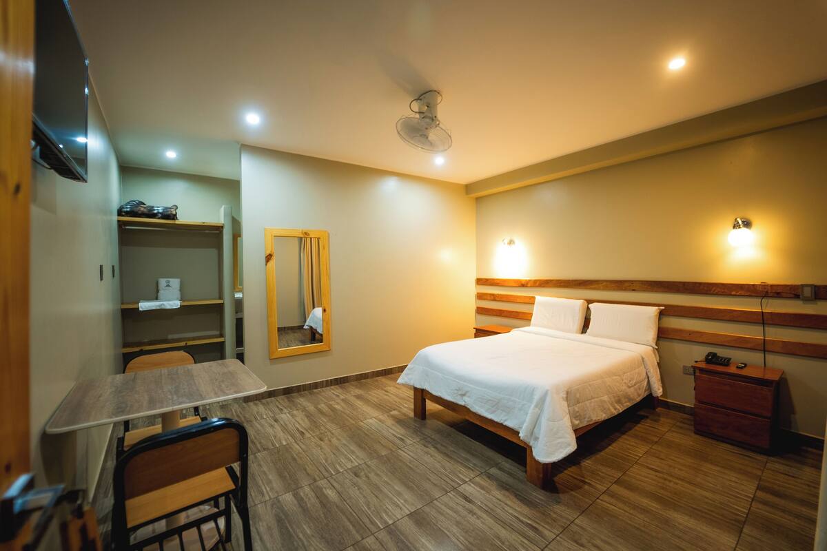 Basic Room, 1 Queen Bed, Garden View | Laptop workspace, WiFi (free), bed sheets