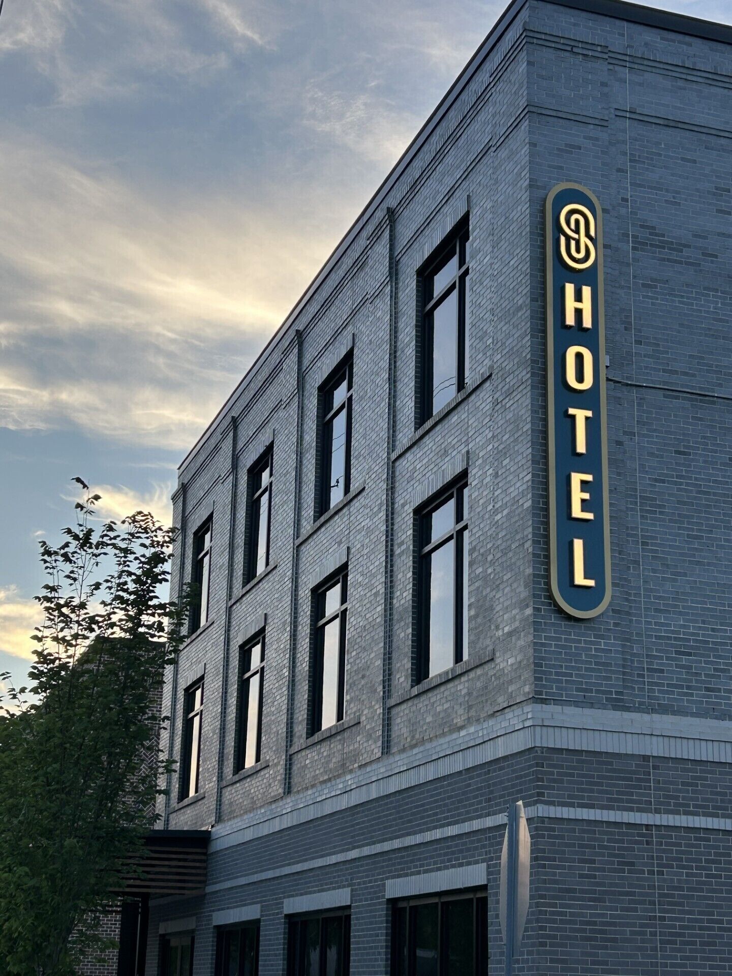 A hotel building with a prominent 'HOTEL' sign on the side.