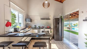 Villa | Private kitchen | Cookware/dishes/utensils, dining tables