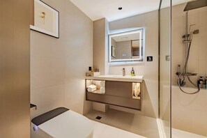 A modern bathroom with a glass shower enclosure, a vanity with a mirror, and a bench. - Anqing Mingjia Hotel (Anqing)
