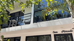 A building with a storefront labeled "Casa Mercado" and a visible address sign "515". - Charming, fully appointed 1-bedroom apartment in PV’s amazing Zona Romantica (Puerto Vallarta)