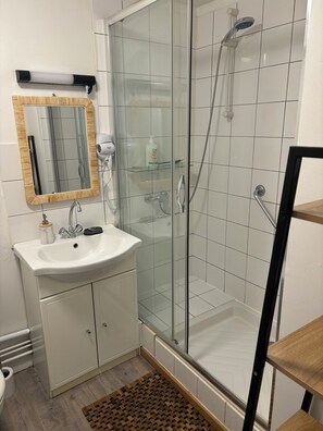 Hair dryer, towels, soap, shampoo