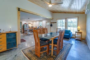 Cozy living space with a dining area, sofa, and cabinet.