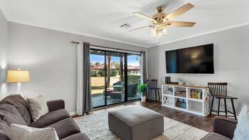 Townhome, Multiple Beds, Patio, Garden View (Beachwalk 18E) | Living area | 65-inch flat-screen TV with digital channels