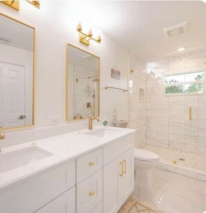 Shower, hair dryer, towels, soap