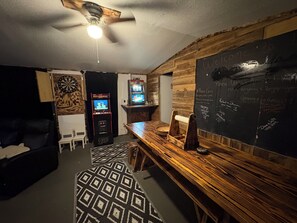 A room with a wooden wall, a dartboard, a dartboard, a dartboard, a dartboard, a dartboard, a dartboard, a dartboard, a dartboard, a dartboard, a dartboard, a dartboard, a dartboard, a dartboard, a dartboard, a dartboard, a dartboard, a dartboard, a dartboard, a dartboard, a dartboard, a dartboard, a dartboard, a dartboard, a dartboard, a dartboard, a dartboard, a dartboard, a dartboard, a dartboard, a dartboard, a dartboard, a dartboard, a dartboard, a dartboard, a dartboard, a dartboard, a dartboard, a dartboard, a dartboard, a dartboard, a dartboard, a dartboard, a dartboard, a dartboard, a dartboard, a dartboard, a dartboard, a dart - Charming waterfront getaway Along Harmon Creek (Huntsville)
