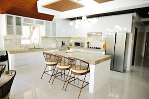 Fridge, microwave, cookware/dishes/utensils - Step into an A-Frame home, where white tropical design meets ultimate comfort. (Bolinao)