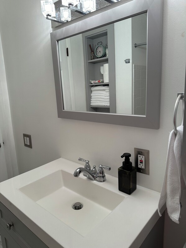 Hair dryer, towels, soap, toilet paper