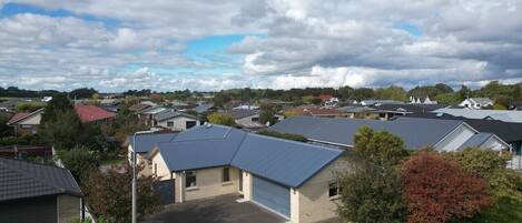 A residential area with houses, a garage, and a driveway.