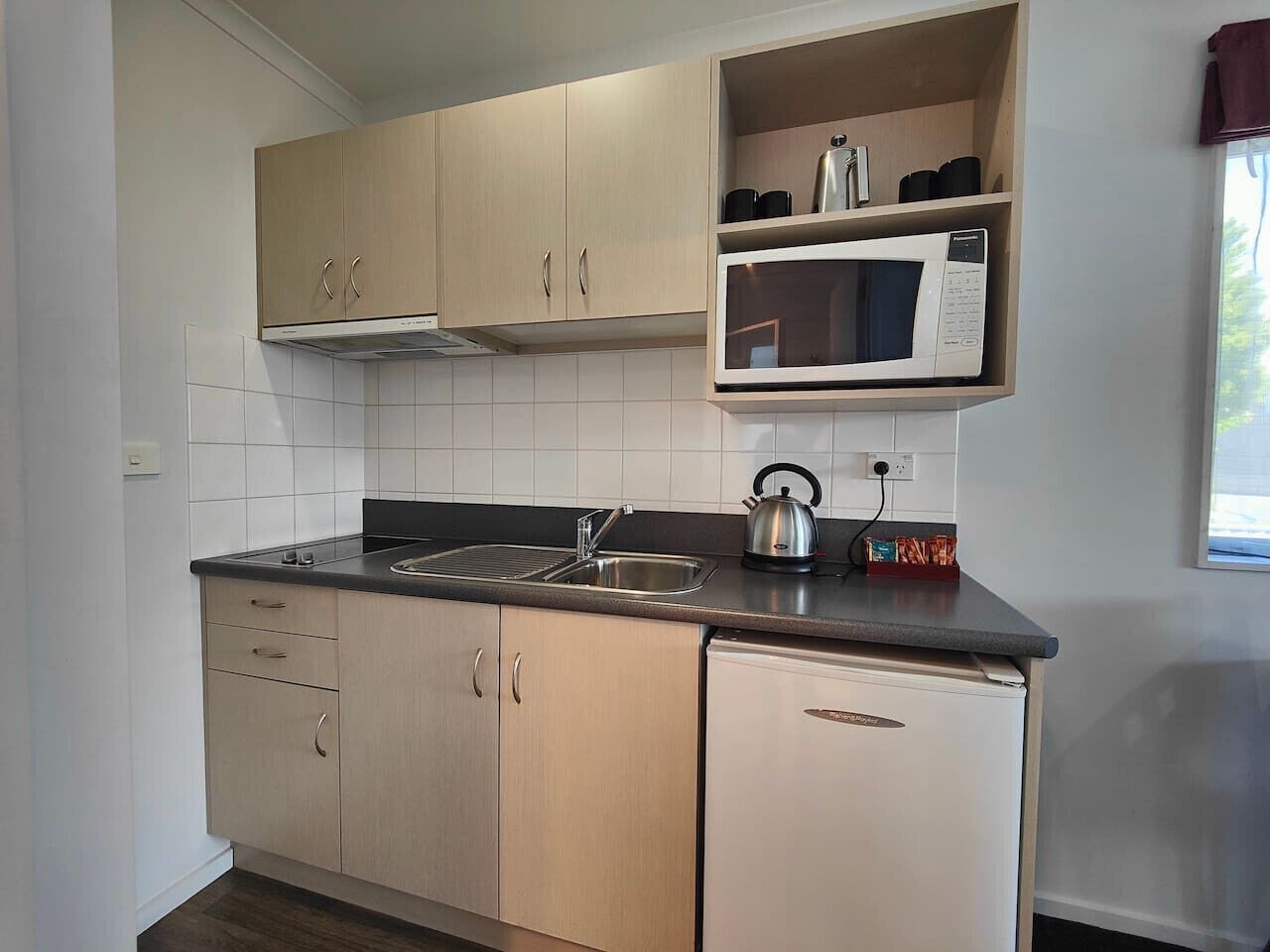 Microwave, cookware/dishes/utensils, dining tables