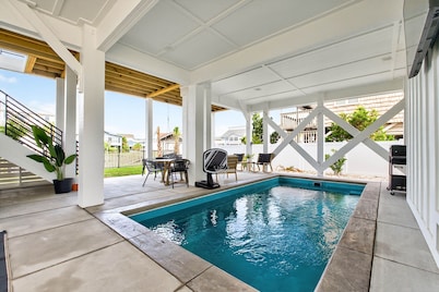 Experience luxury at Steel N Suns, a spacious 6bd 6ba Elevator, Heated Pool & Dock