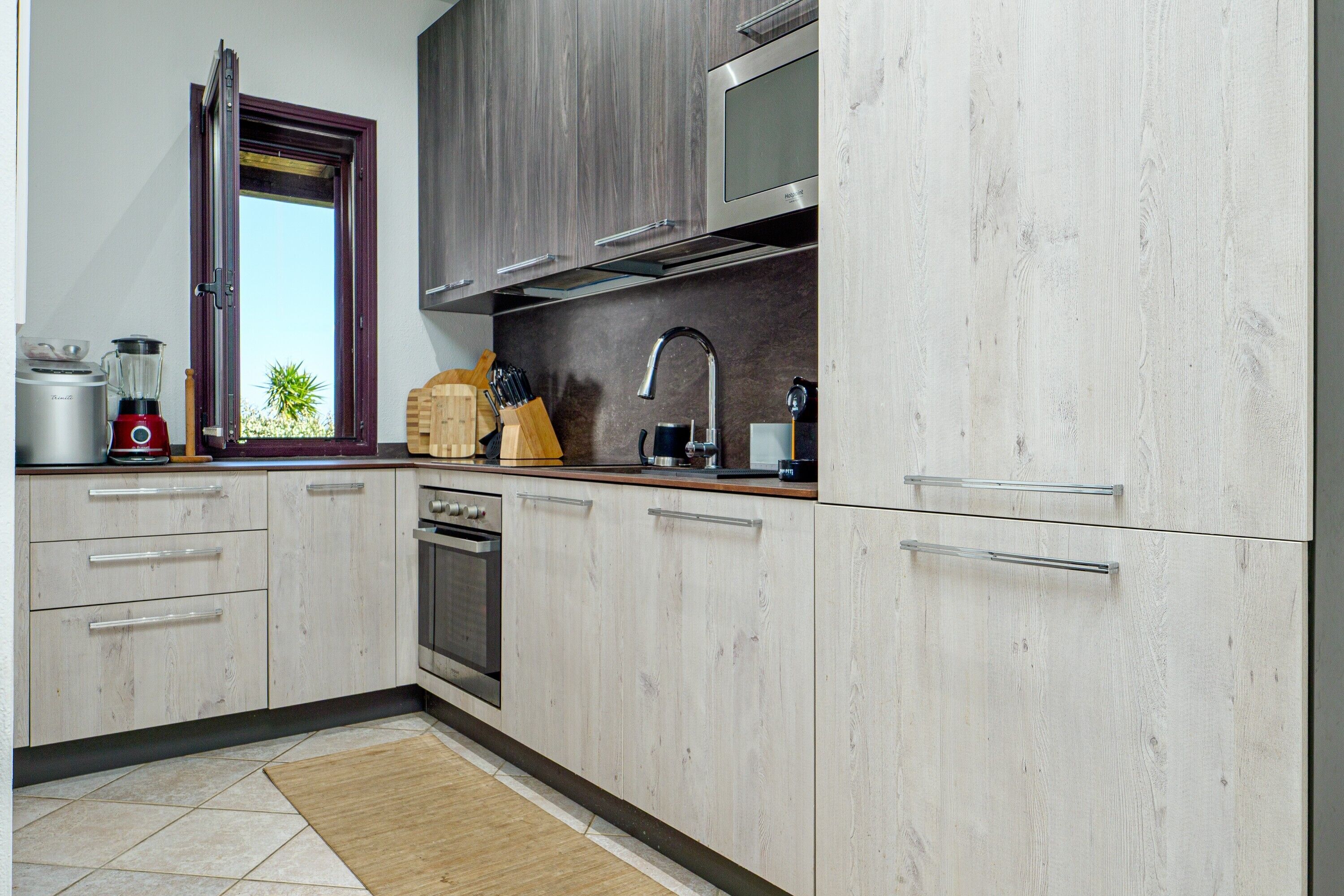 Fridge, dishwasher, coffee/tea maker, cookware/dishes/utensils