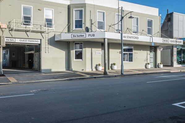 A building with a sign for 'The Bunker' pub and '66 Stafford' guesthouse.