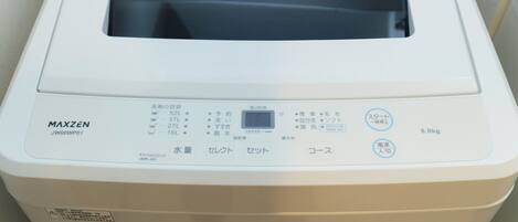 A white MAXZEN JW60WP01 laundry machine with a control panel, water level indicator, and a 6.0kg capacity label.