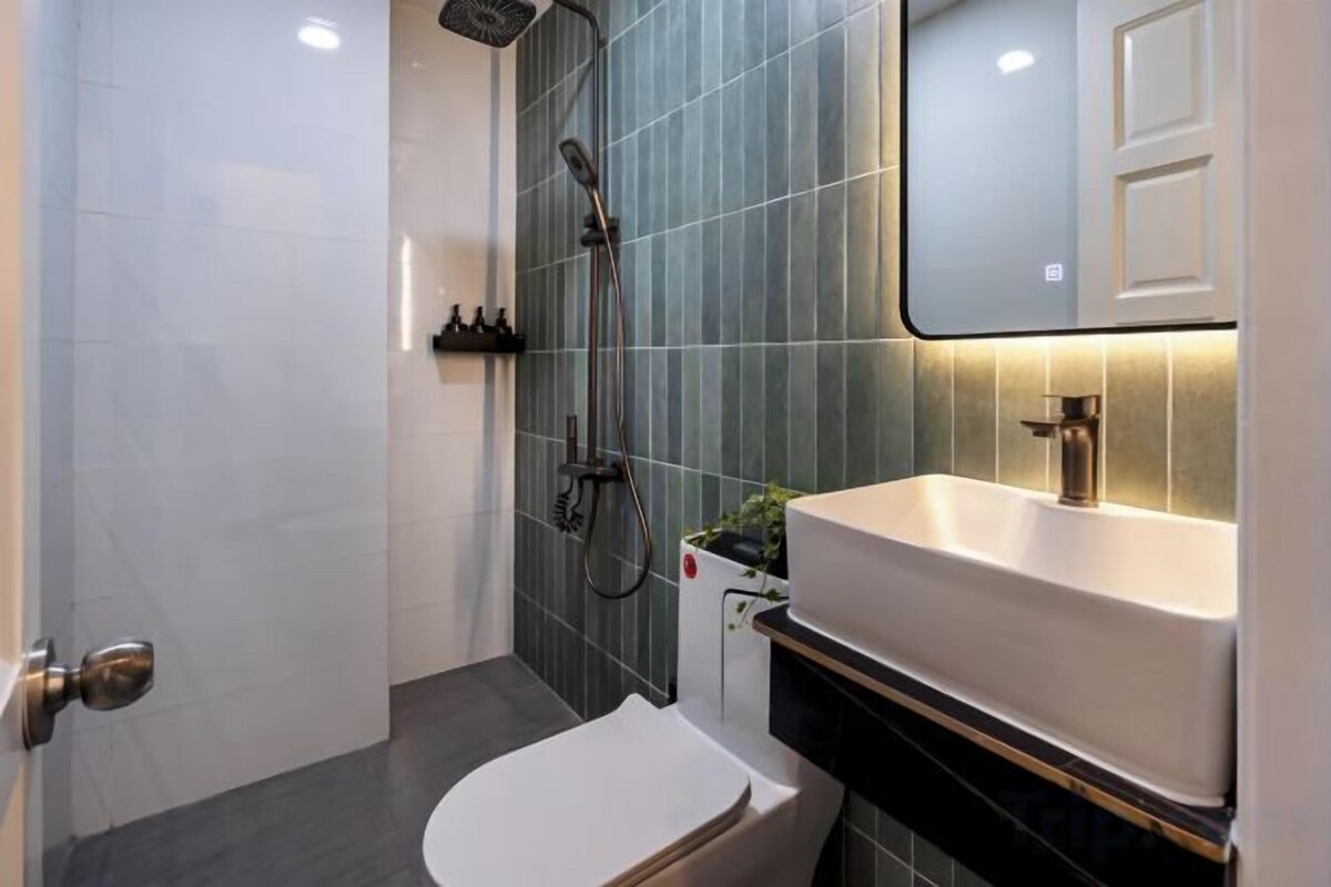 Bathroom | Shower, hair dryer, slippers, towels