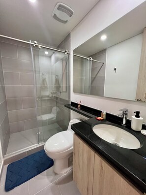 Shower, hair dryer, towels, soap
