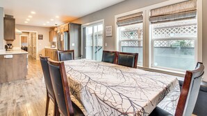 A modern kitchen with a dining area. - 1 Mi to Oregon Dunes: Quiet Getaway w/ Deck (Lakeside)