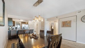 A modern kitchen with a dining area. - 2 BD Lake View Condo, with Jacuzzi Tub, Covered Deck, Resort Amenities and Discount Tickets (Branson)