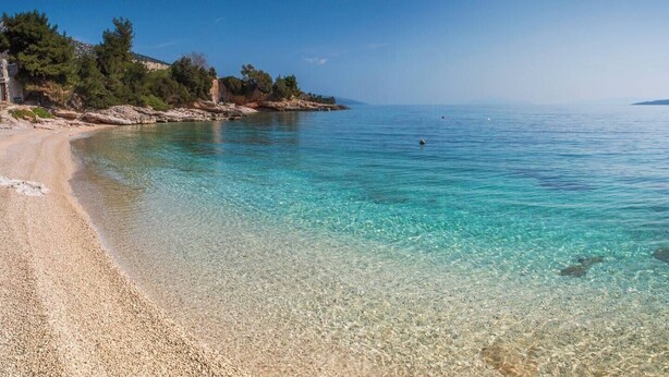 A clear beach with a pebble shore and rocky outcrops. - Luxury Villa in Zavala w/pool (Zavala, Jelsa)