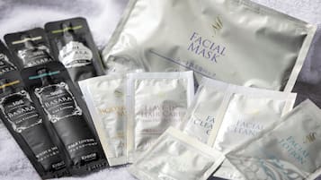 Various skincare and haircare products including facial masks, gel lotions, and leave-in hair care items.