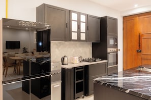 Fridge, microwave, cookware/dishes/utensils