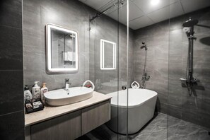 Executive Studio Suite | Bathroom | Separate bathtub and shower, deep-soaking bathtub - T.26 Hotel (Da Nang)