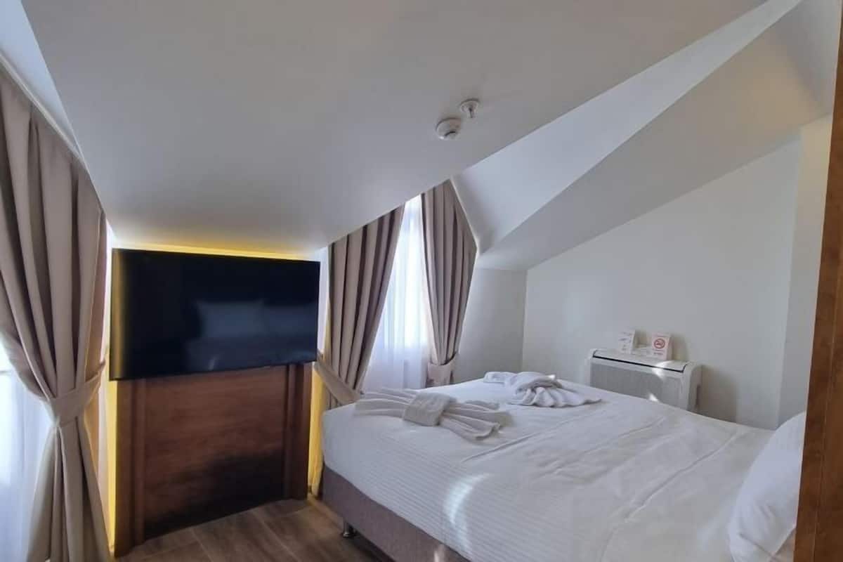 Biancheria da letto di alta qualità, minibar, cassaforte in camera