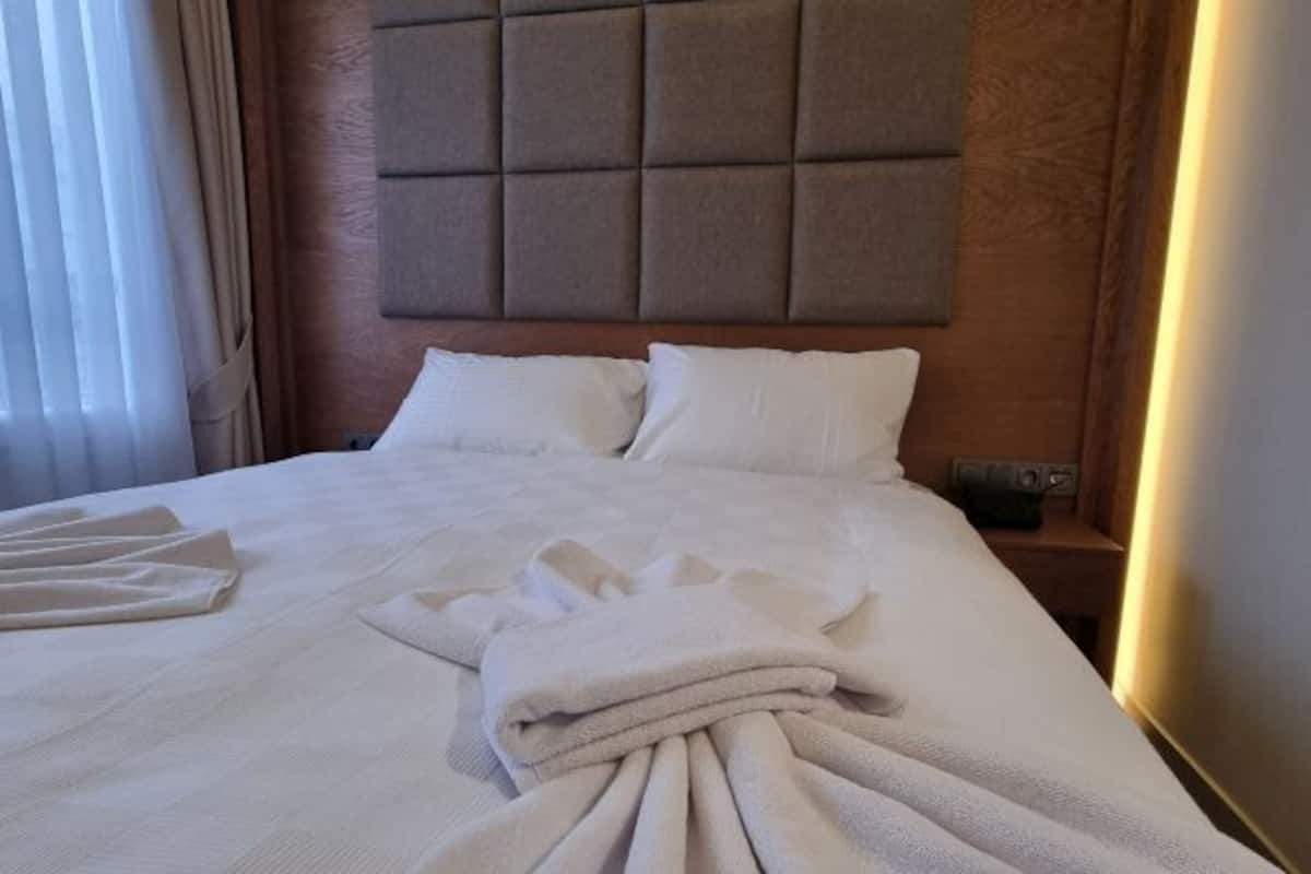 Biancheria da letto di alta qualità, minibar, cassaforte in camera