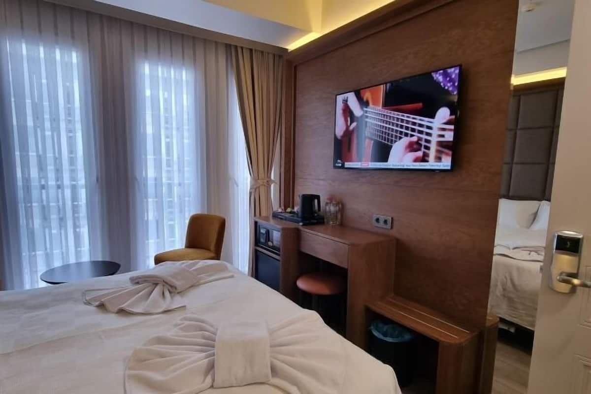 Biancheria da letto di alta qualità, minibar, cassaforte in camera
