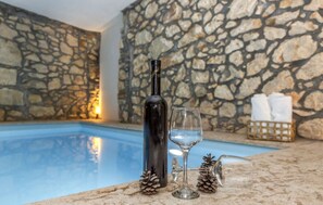 Relax by the serene pool, surrounded by a peaceful ambiance and amenities for ultimate relaxation.