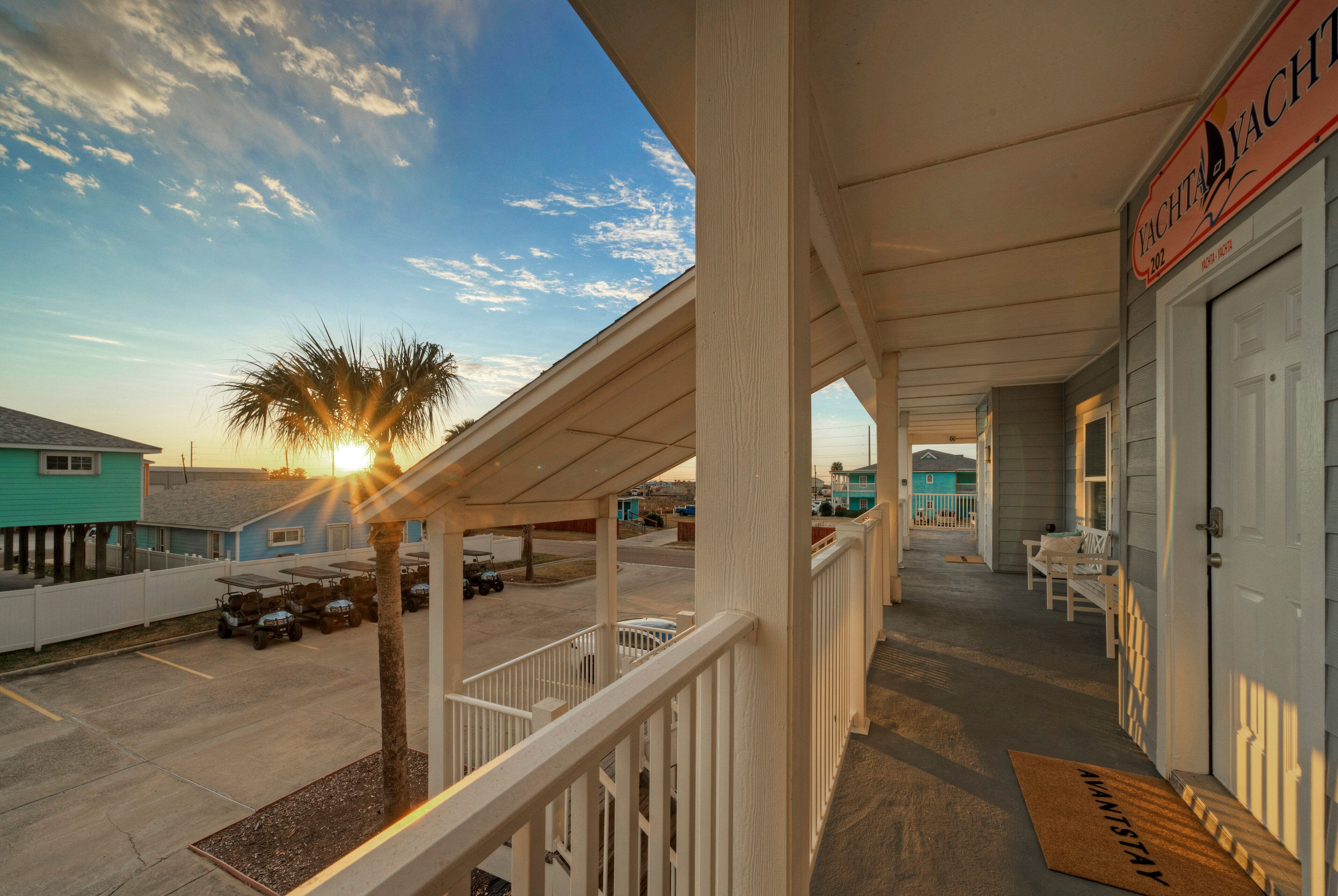 A covered outdoor area with a sign reading "Yacht & Yacht Club."