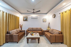 Deluxe Villa, 5 Bedrooms, Patio, Garden View | Living room | Flat-screen TV - ELIVAAS 5 BHK With Pvt Pool - Zenora (Taoru)