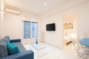 City Apartment, Balcony | Living area | 43-inch TV with cable channels
