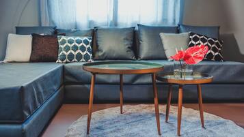 Executive Apartment | Living area | 42-inch Smart TV with cable channels