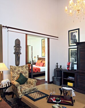 Minibar, desk, laptop workspace, bed sheets