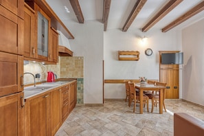 Family Apartment, 2 Bedrooms (Seaside Villa Marittima Apartment) | Private kitchen | Fridge, stovetop, coffee/tea maker, cookware/dishes/utensils