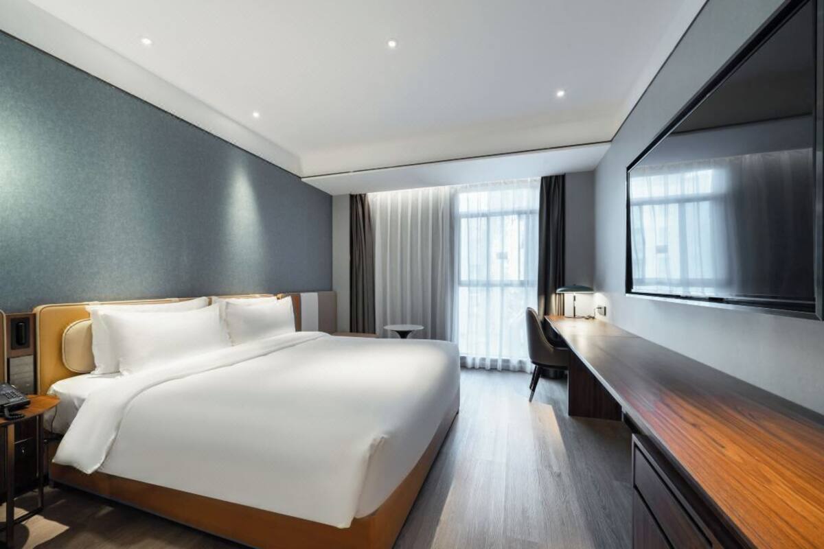 ห้องดีลักซ์ซิงเกิล | เครื่องนอนระดับพรีเมียม, เตียงพร้อมฟูกเสริมที่นอน, Wi-Fi ฟรี