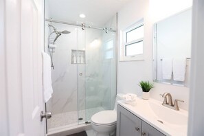 Shower, hair dryer, soap, shampoo