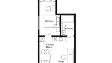 A floor plan with a bedroom, bathroom, kitchen/dining, and lounge area.