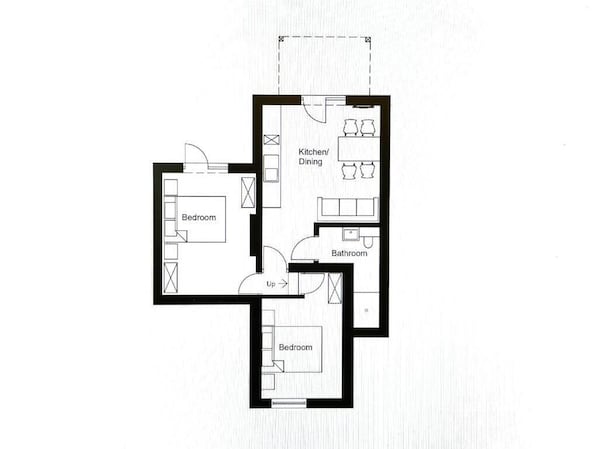 A floor plan with two bedrooms, a kitchen/dining area, and a bathroom.