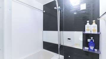 Shower, hair dryer, slippers, towels