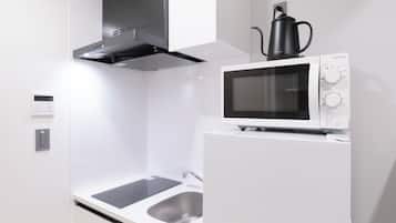 Fridge, microwave, stovetop, cookware/dishes/utensils