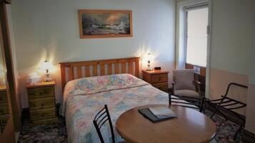 Premium bedding, desk, laptop workspace, iron/ironing board