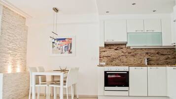 Oven, dishwasher, dining tables