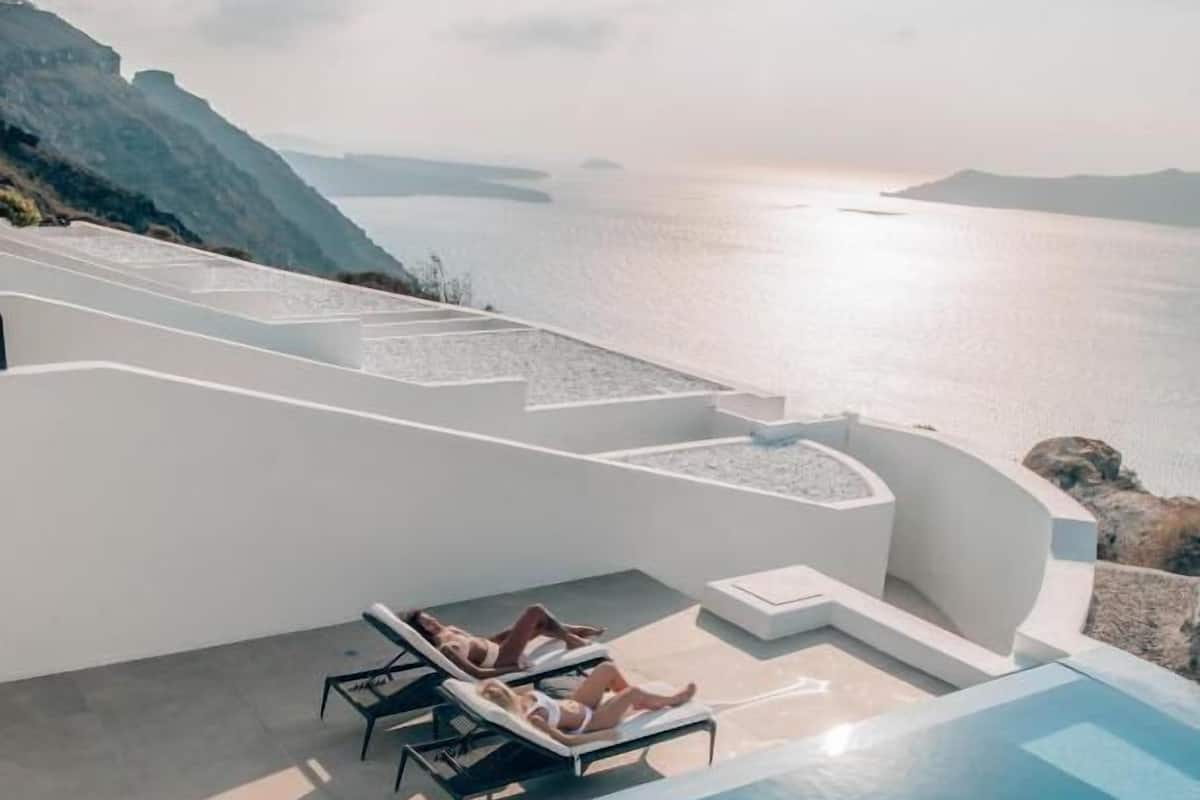 Grand Honeymoon Suite Private Pool with Caldera Sunset View | Minibar, in-room safe, soundproofing, iron/ironing board