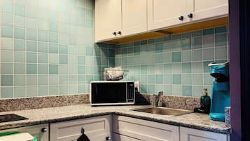 Fridge, microwave, stovetop, coffee/tea maker