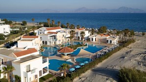 A resort with multiple swimming pools, beachfront, and a view of the sea. - Atlantica Marmari Beach (Kos)