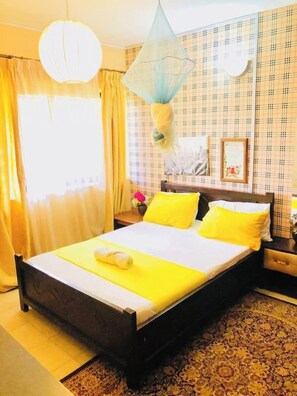 Economy Double Room, Balcony | Individually decorated, individually furnished, iron/ironing board