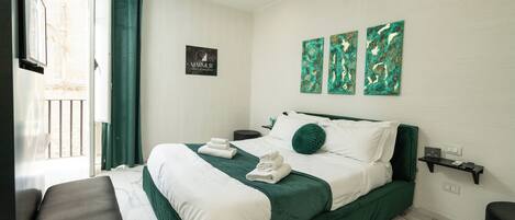 Deluxe Room, Hot Tub, City View | In-room safe, blackout drapes, soundproofing, iron/ironing board